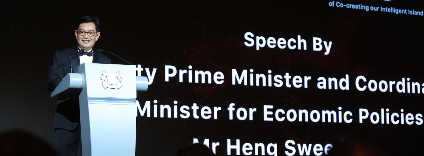 Mr. Heng Swee Keat at podium giving a speech. Singapore coat of arms on podium. Text: "Speech By..."